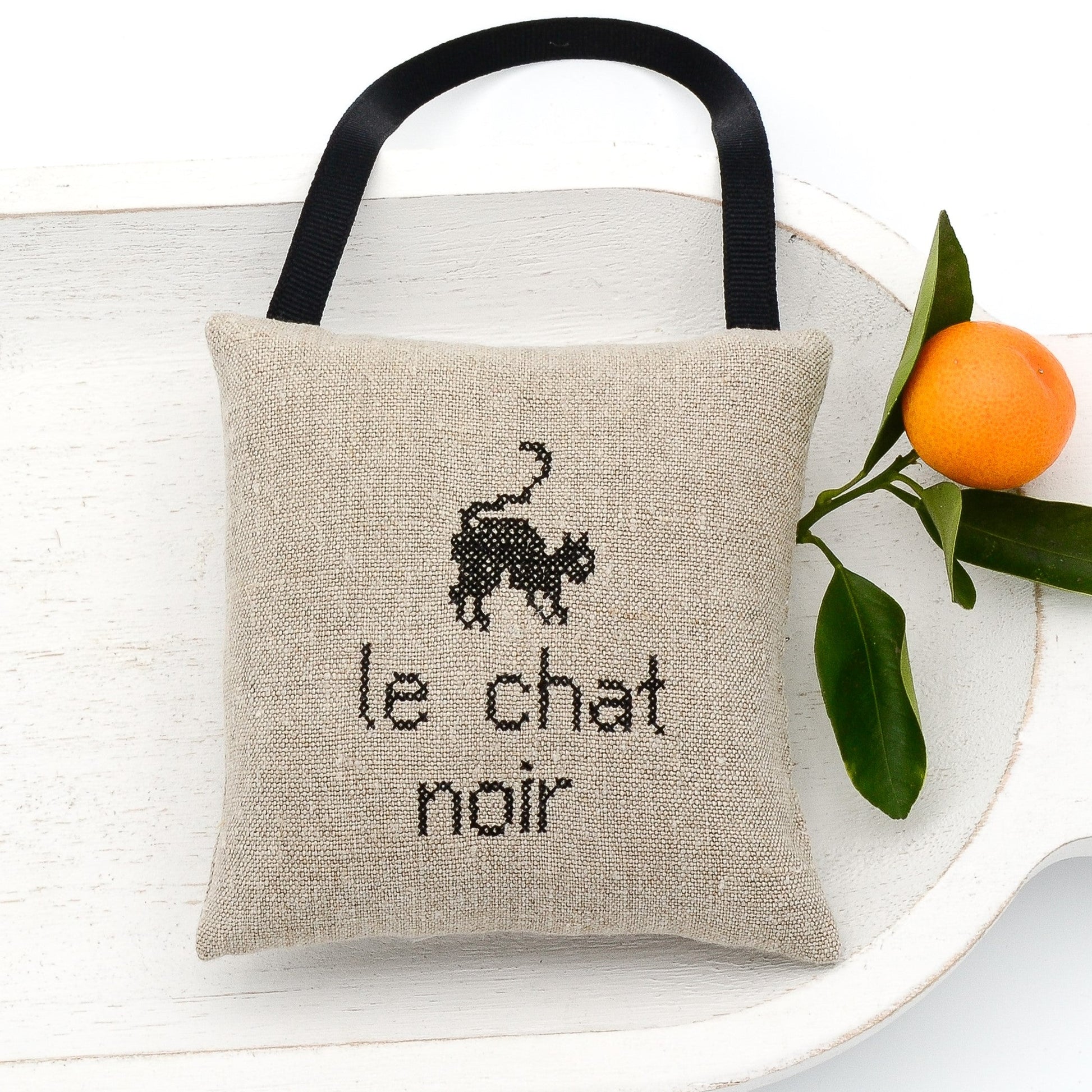 Vintage German mangle cloth natural tone linen lavender sachet square, "Le chat noir" and cat embroidered in black cross stitch, black gros grain ribbon tie, filled with high quality lavender from Provence France
