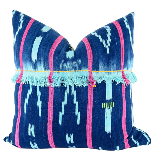 Front of pillow with rich blue patterns, red stripes and blue fringe made from vintage handwoven Baoulé/Baule cotton cloth from Africa's Ivory Coast, reflecting the traditions, symbols, and tribal lives of the Baoulé/Baule people