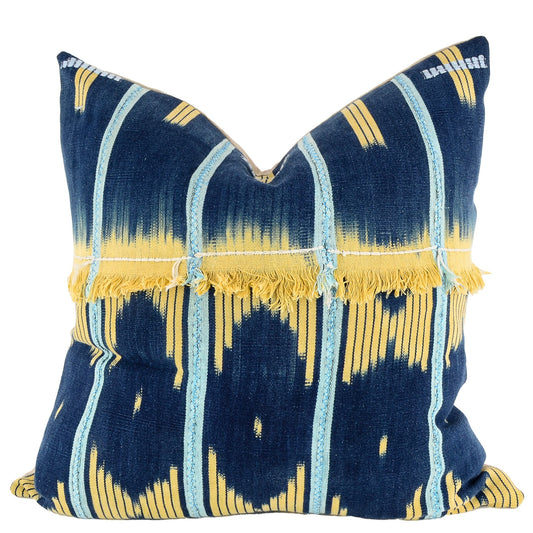 Front of pillow with rich blue and yellow patterns and yellow fringe made from vintage handwoven Baoulé/Baule cotton cloth from Africa's Ivory Coast, reflecting the traditions, symbols, and tribal lives of the Baoulé/Baule people