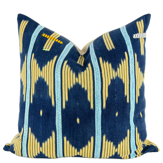 Front of pillow with rich blue and yellow patterns made from vintage handwoven Baoulé/Baule cotton cloth from Africa's Ivory Coast, reflecting the traditions, symbols, and tribal lives of the Baoulé/Baule people