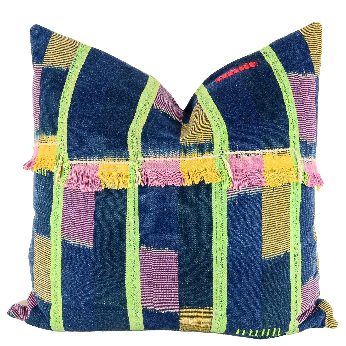 Front of pillow with rich blue, pink and yellow patterns, green stripes, colorful embroidery and pink and yellow fringe made from vintage handwoven Baoulé/Baule cotton cloth from Africa's Ivory Coast, reflecting the traditions, symbols, and tribal lives of the Baoulé/Baule people