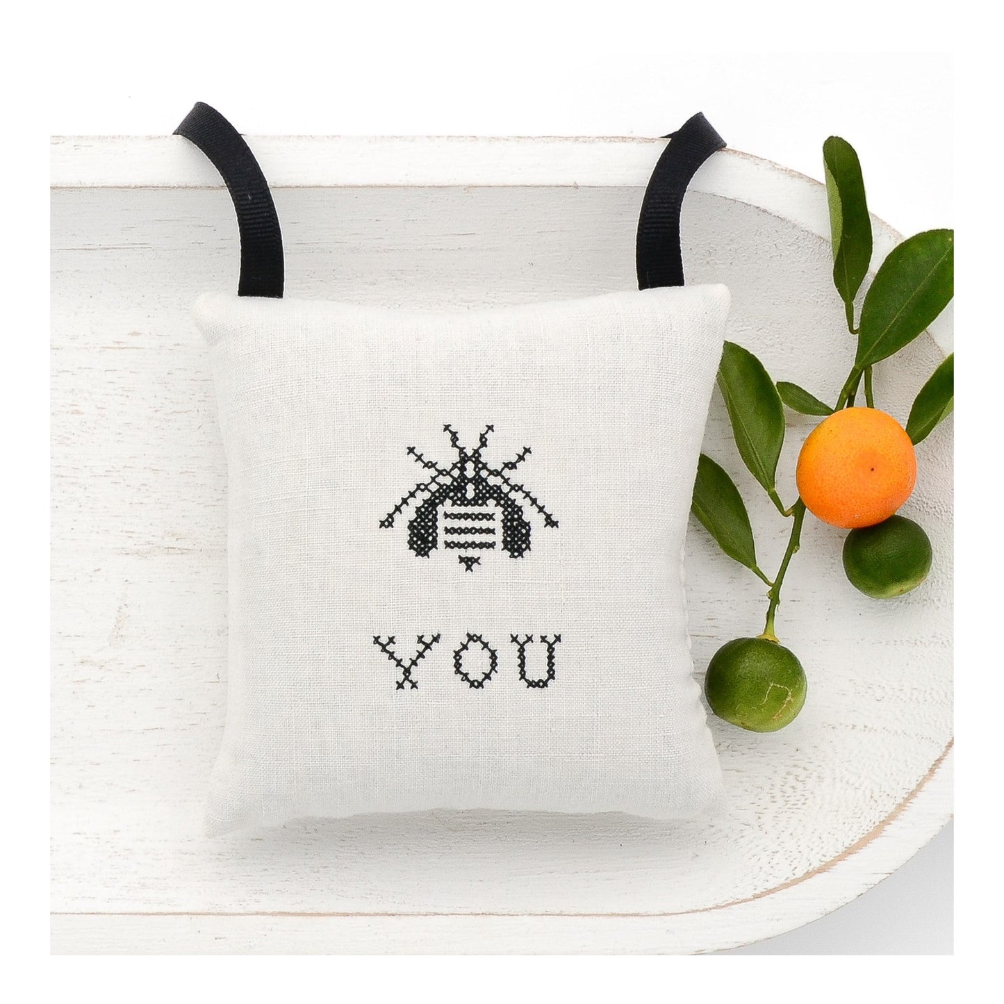 Antique European white linen lavender sachet square, bee and "You" embroidered in black cross stitch, black gros grain ribbon tie, filled with high quality lavender from Provence France