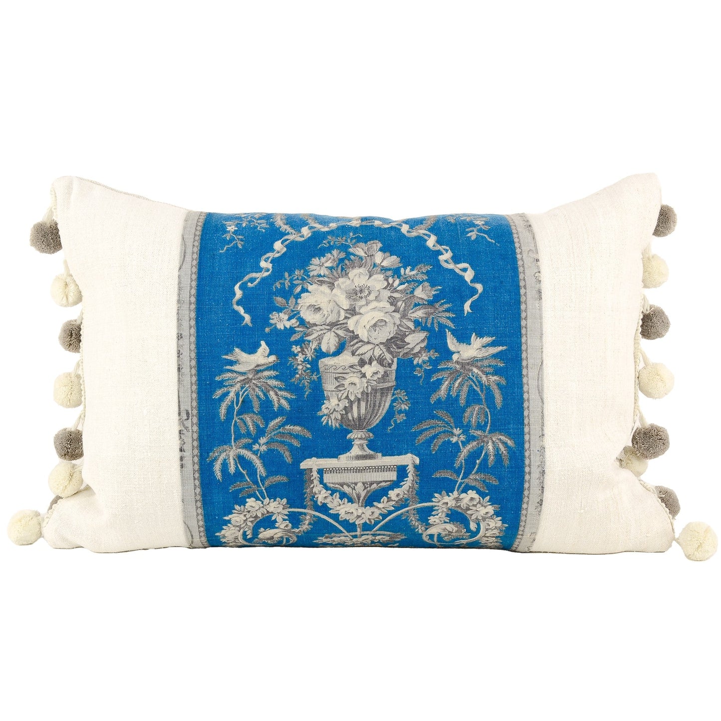 Front of pillow made from a vintage blue, gray and white French fabric with antique European eggshell grain sack linen on both sides of the French fabric and  four gray and four white tassles on each side of the pillow