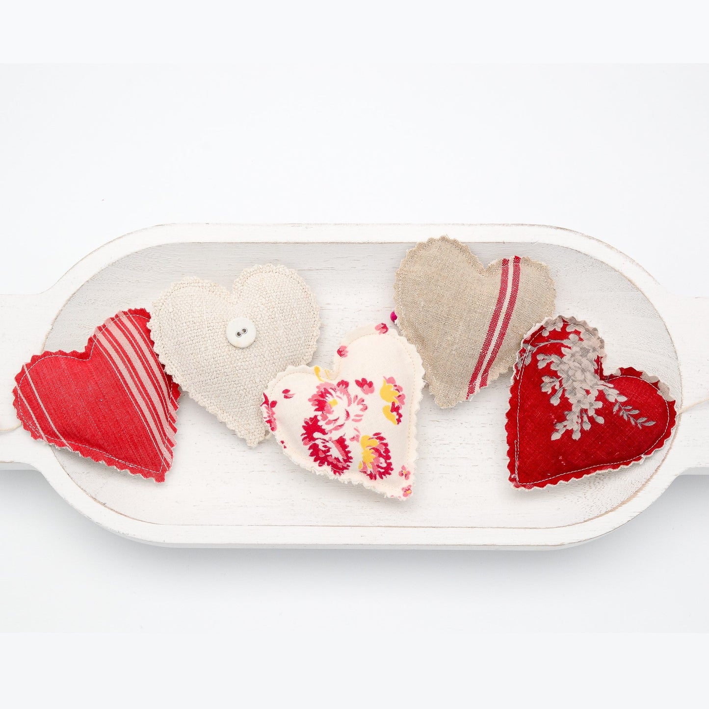 Focus on two hearts in this vintage French fabric garland, white cotton twine and wooden beads between hearts