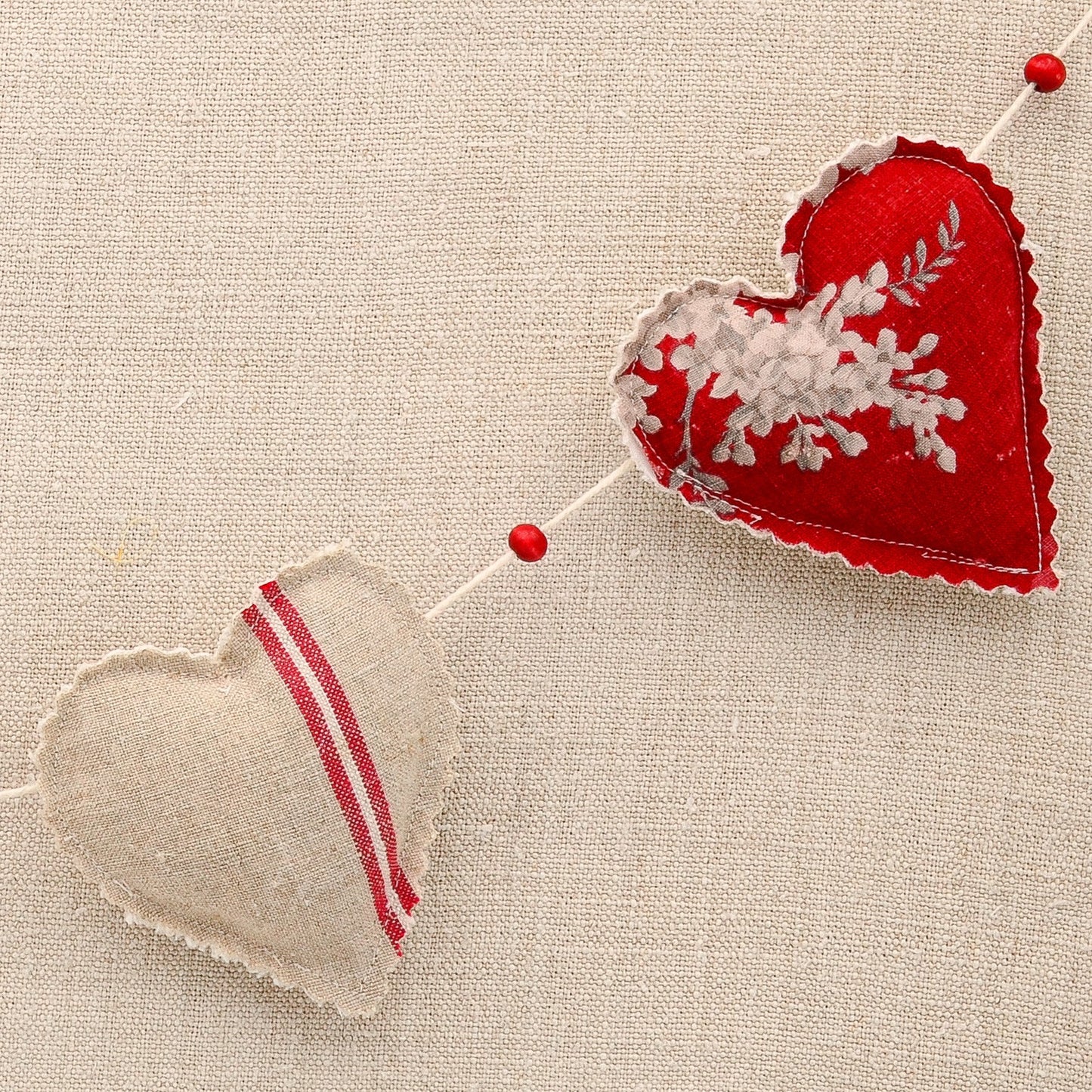 Vintage French fabric garland, five colorful hearts, white cotton twine and wooden beads between hearts