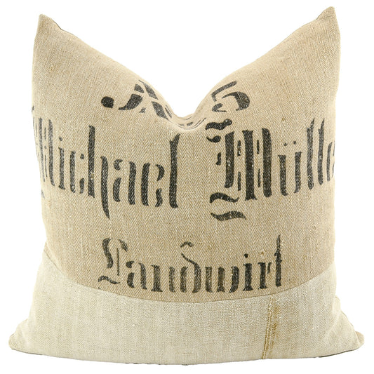 Front of pillow made from antique German natural tone grain sack linen with black stenciled lettering as follows: "No. 5, Michael Müller, Landwirt"