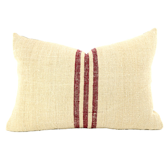 Front of pillow made from antique European grain sack natural tone linen with a deep maroon vertical stripes in the middle of the pillow