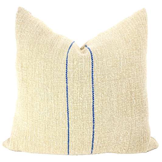 Front of pillow made from antique European grain sack natural tone linen with two rich blue vertical stripes in the middle of the pillow
