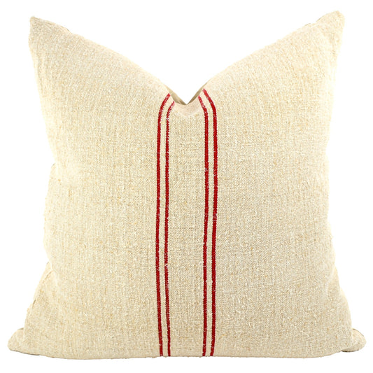 Front of pillow made from antique European grain sack natural tone linen with red vertical stripes in the middle of the pillow