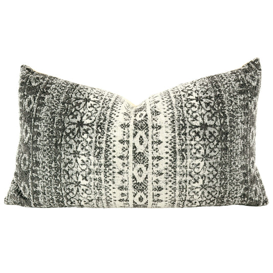 Front of pillow made from a contemporary/modern fabric with rich black, gray and white patterns