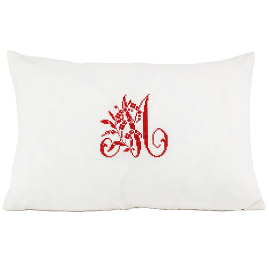 Front of pillow made from vintage European white linen with a red embroidered antique French letter monogram