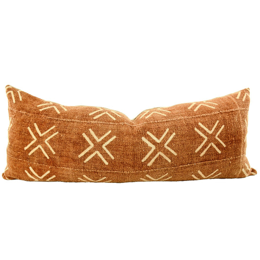 Front of pillow with rich brown and white patterns made from a traditional handwoven mudcloth textile sheet from Mali West Africa