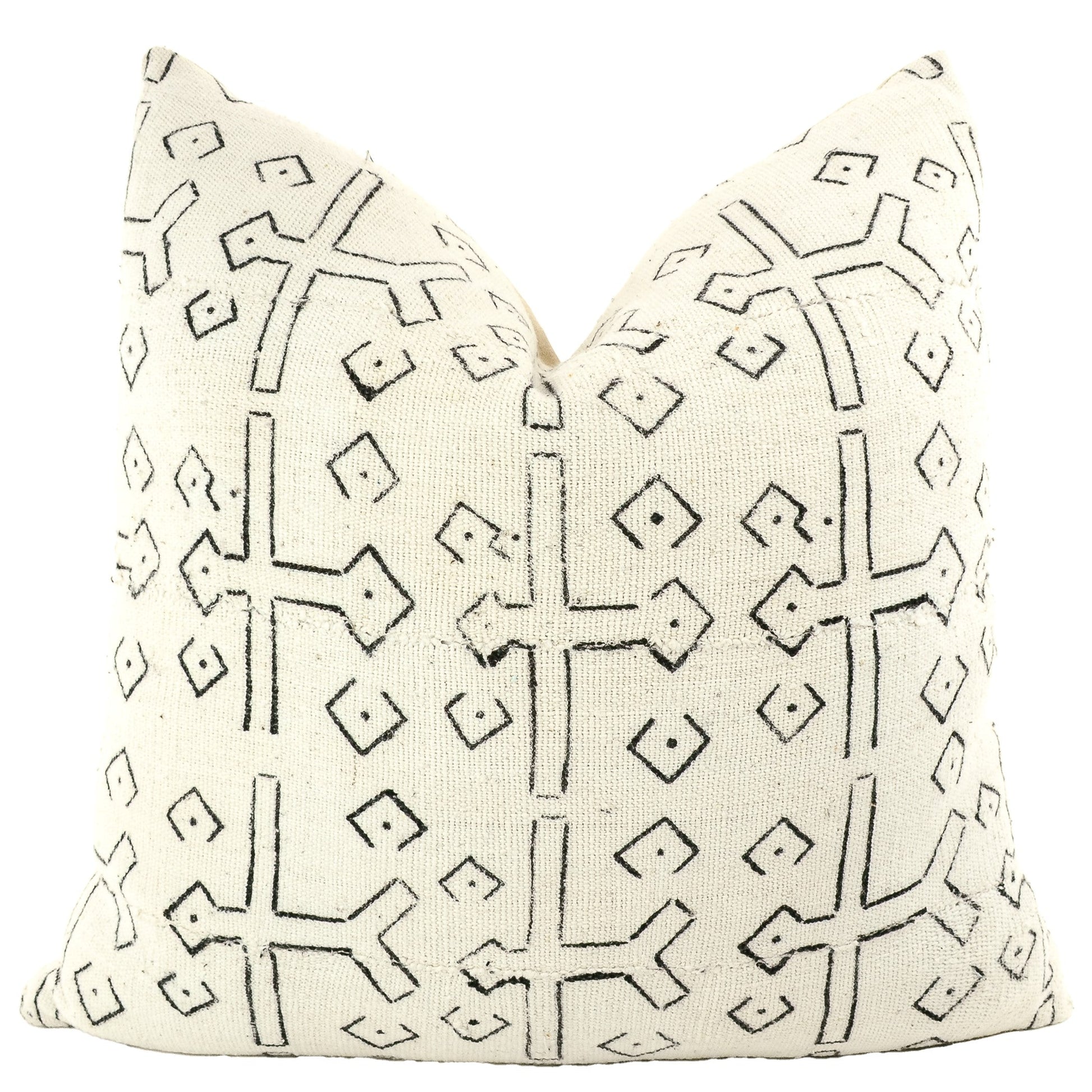 Front of pillow with rich white and black patterns made from a traditional handwoven mudcloth textile sheet from Mali West Africa