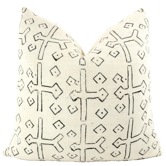 Front of pillow with rich white and black patterns made from a traditional handwoven mudcloth textile sheet from Mali West Africa