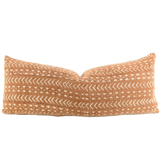Front of pillow with rich brown and white patterns made from a traditional handwoven mudcloth textile sheet from Mali West Africa