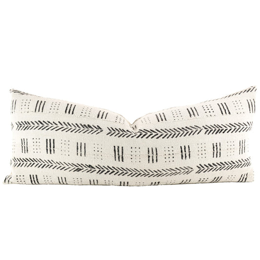Front of pillow with rich white and black patterns made from a traditional handwoven mudcloth textile sheet from Mali West Africa