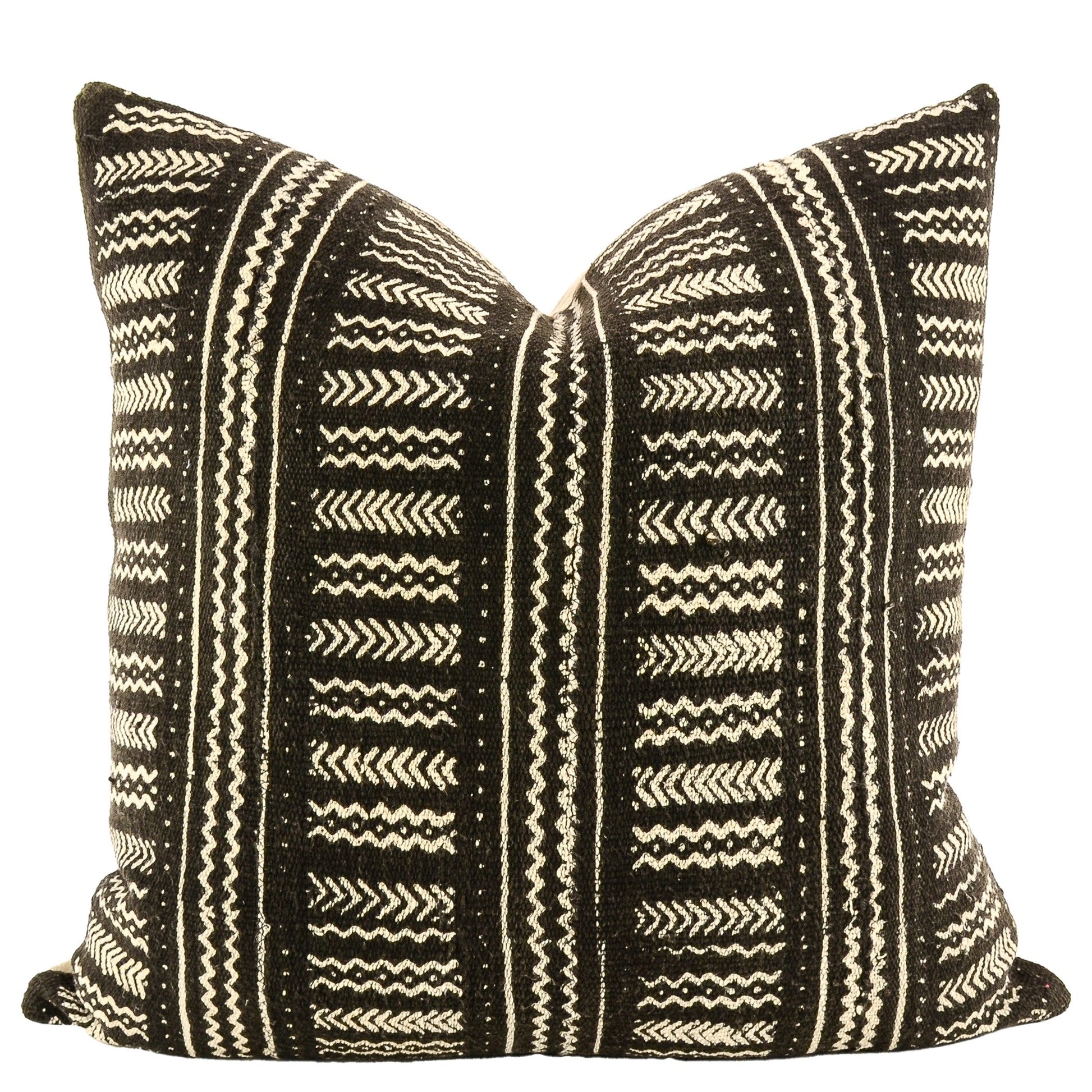 Front of pillow with rich black and white patterns made from a traditional handwoven mudcloth textile sheet from Mali West Africa