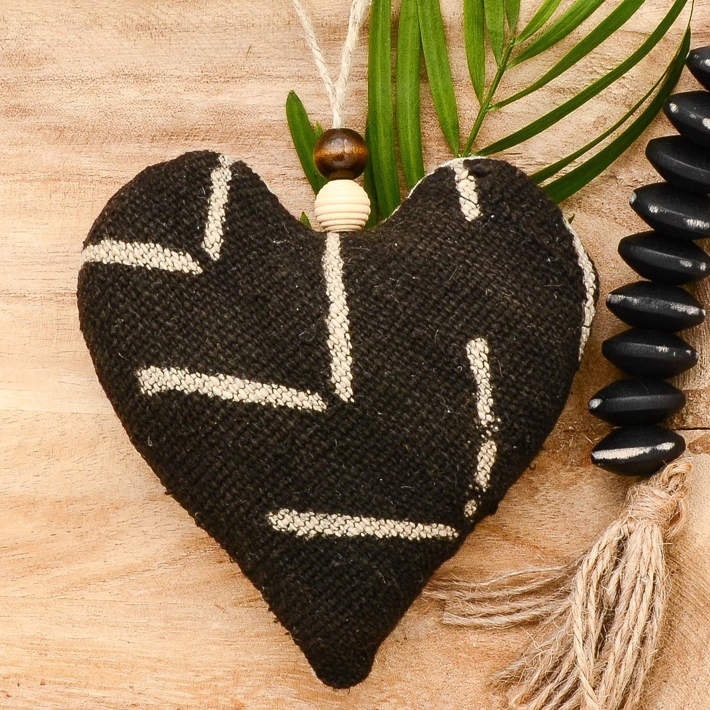 Lavender sachet heart made from handwoven mudcloth from Africa, black with white markings , hemp twine tie with wooden beads, filled with high quality lavender from Provence France