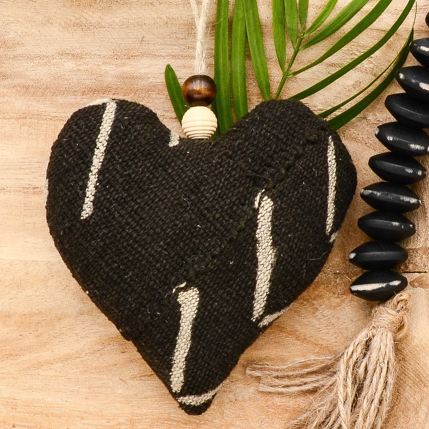 Lavender sachet heart made from handwoven mudcloth from Africa, black with white markings , hemp twine tie with wooden beads, filled with high quality lavender from Provence France