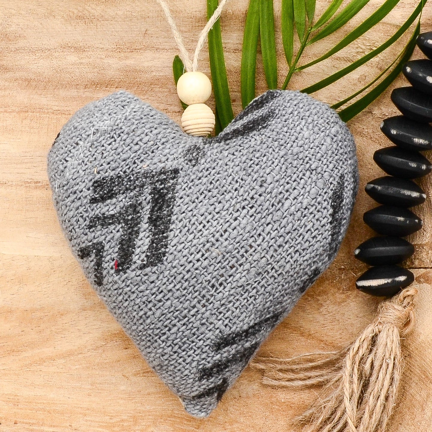 Lavender sachet heart made from handwoven mudcloth from Africa, gray with black markings , hemp twine tie with wooden beads, filled with high quality lavender from Provence France