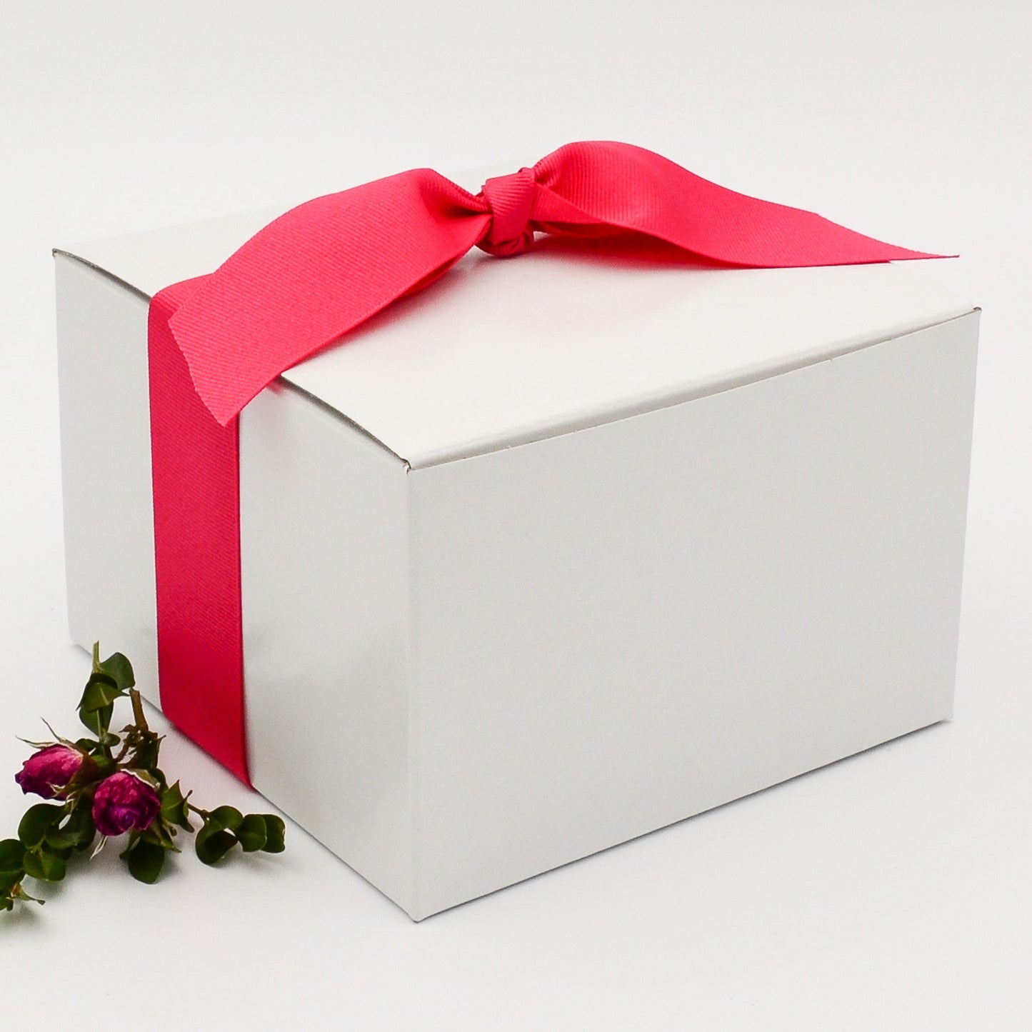 Gift box with hot pink gros grain ribbon and selection of eight greeting cards, which may be personalized