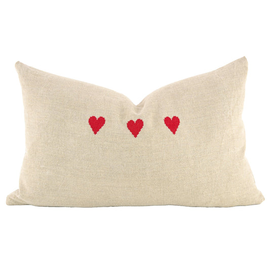 Front of pillow made from vintage European mangle cloth linen with a natural tone from Germany and embroidered with three red hearts