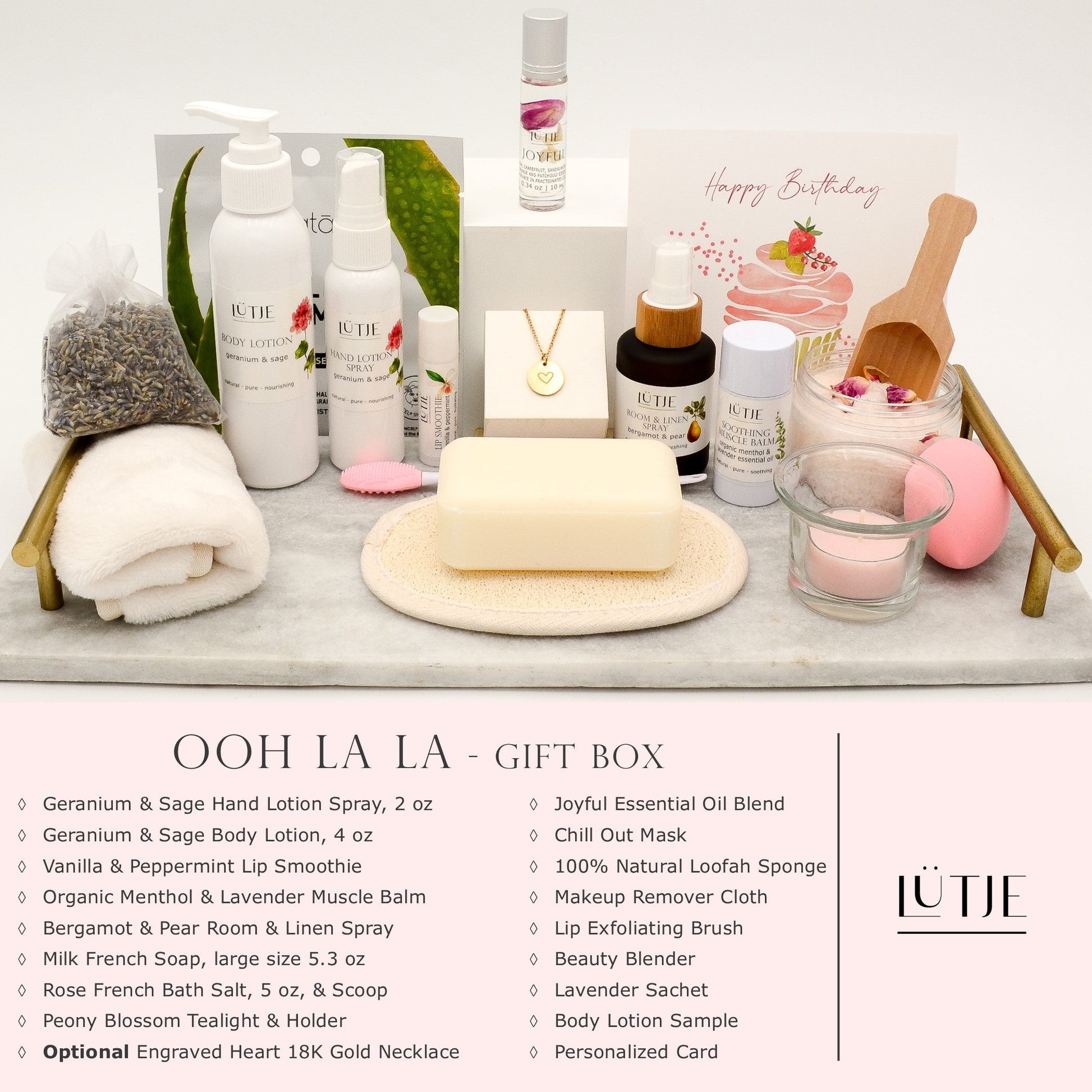 Ooh La La Gift Box for women, wife, daughter, BFF, sister, mom, or grandma, includes Geranium & Sage hand lotion spray and body lotion, essential oil, lip balm, soothing muscle balm, Bergamot & Pear room & linen spray, French soap, French bath salts, hydrating face mask, other bath, spa and self-care items, and 18K gold-plated necklace with engraved heart.