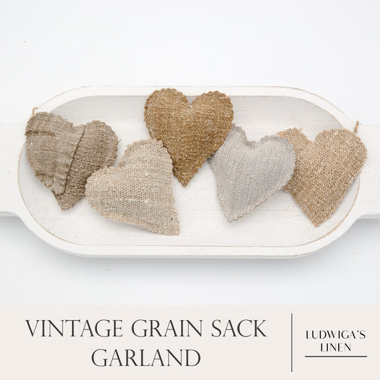 Vintage European grain sack linen garland, five hearts on white cotton or hemp twine