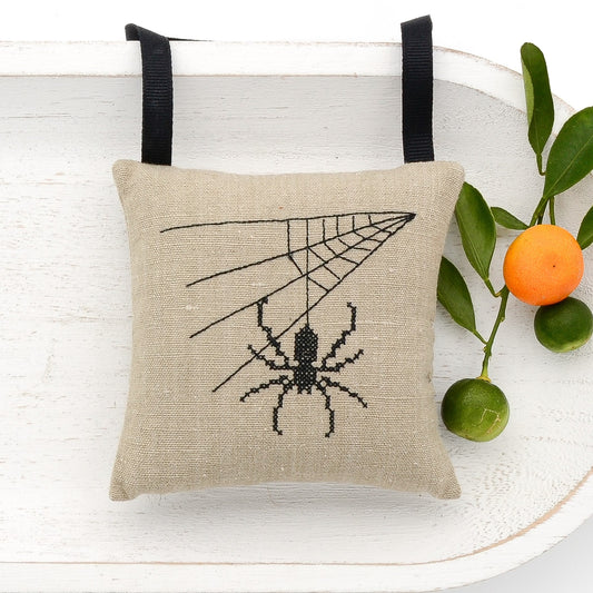 Vintage German mangle cloth natural tone linen lavender sachet square, spider and web embroidered in black cross stitch, black gros grain ribbon tie, filled with high quality lavender from Provence France