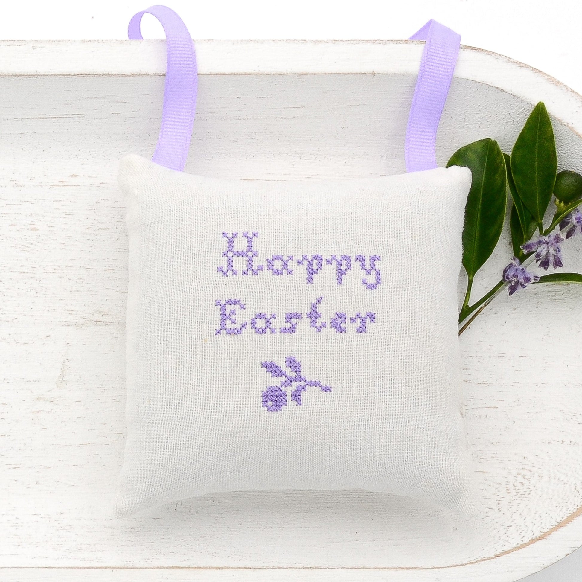 Antique European white linen lavender sachet square, "Happy Easter" and twig embroidered in purple cross stitch, purple gros grain ribbon tie, filled with high quality lavender from Provence France