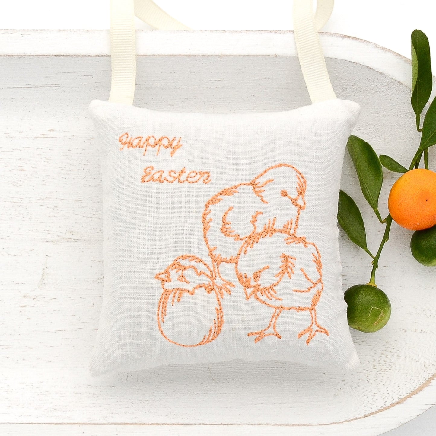 Antique European white linen lavender sachet square, "Happy Easter" and chicks embroidered in orange cross stitch, cream-colored gros grain ribbon tie, filled with high quality lavender from Provence France