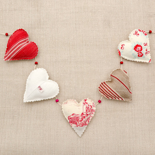 Vintage French fabric garland, five colorful hearts, white cotton twine and wooden beads between hearts