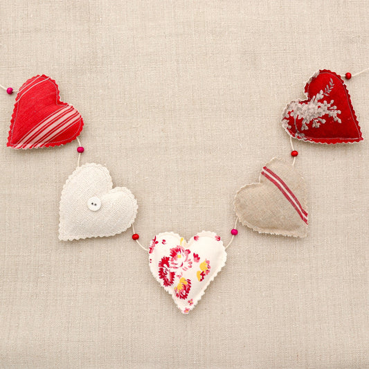 Vintage French fabric garland, five colorful hearts, white cotton twine and wooden beads between hearts