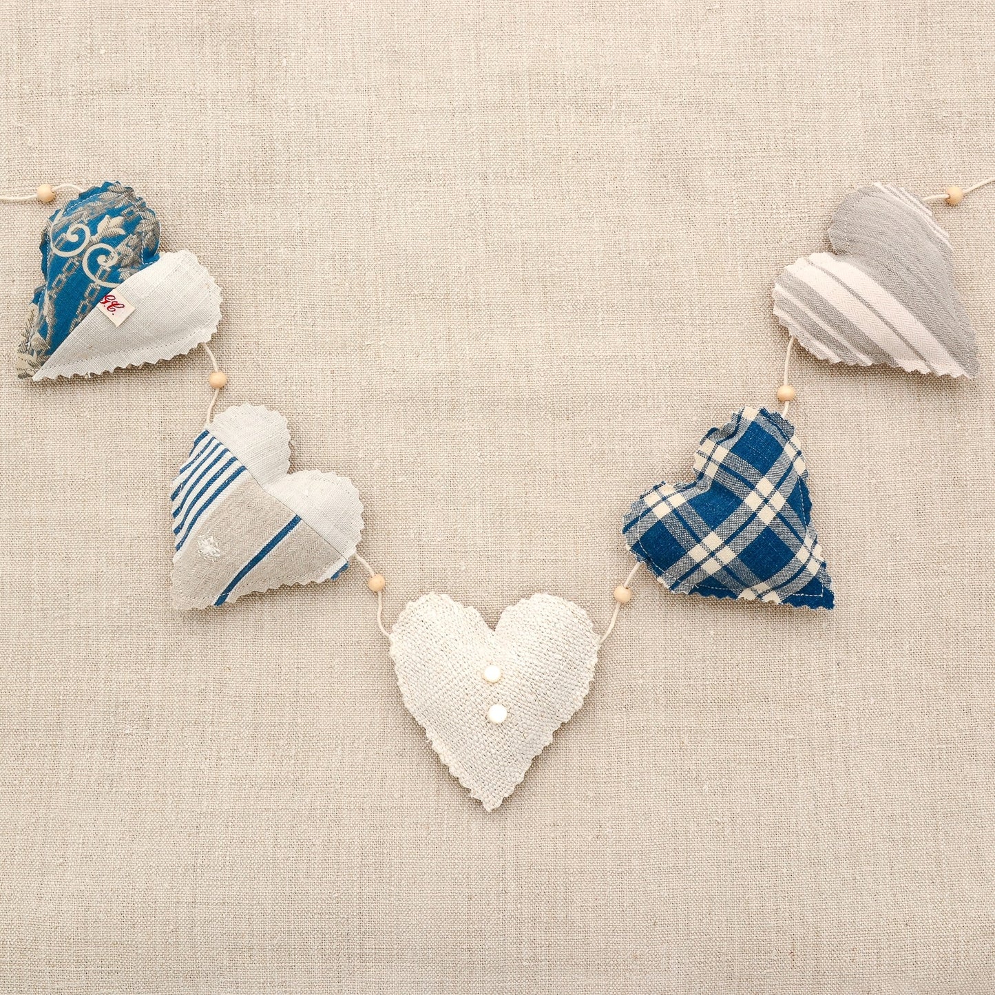 Vintage French fabric garland, five colorful hearts, white cotton twine and wooden beads between hearts