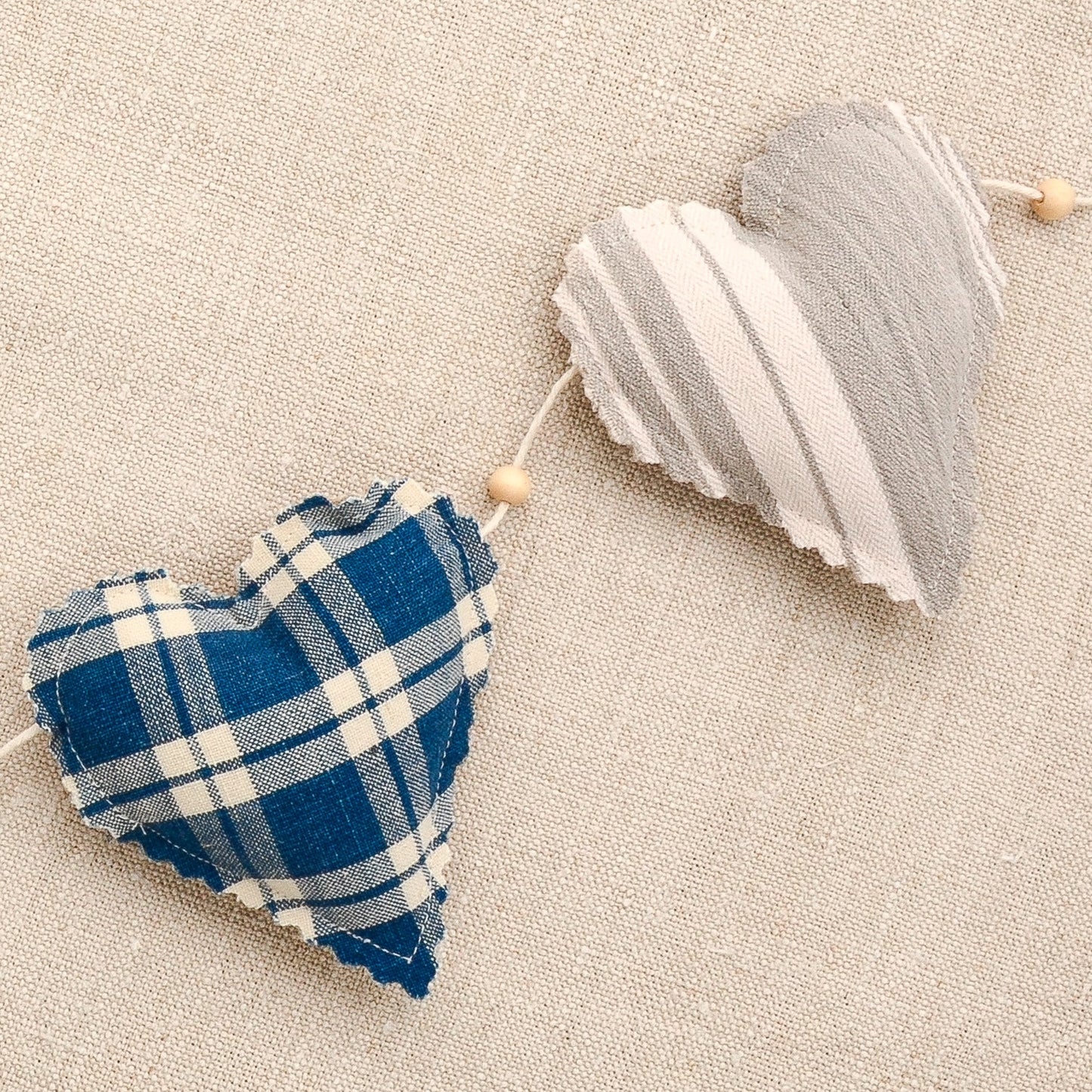 Vintage French fabric garland, five colorful hearts, white cotton twine and wooden beads between hearts