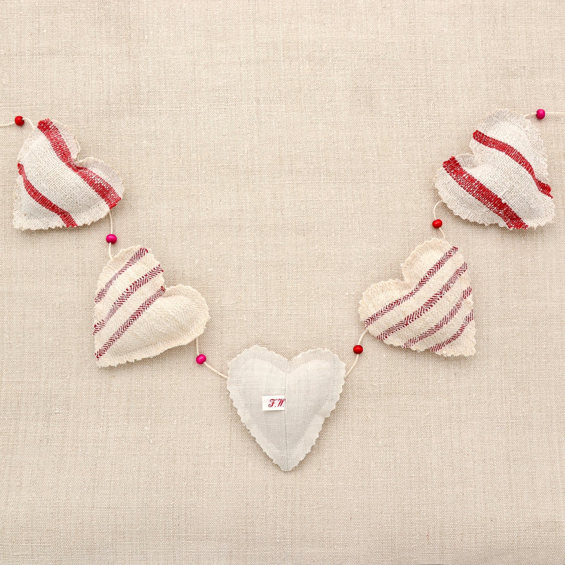 Antique European grain sack linen garland, five hearts, red stripes on natural tone linen, white cotton or hemp twine