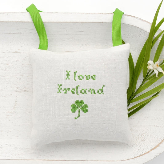 Antique European white linen lavender sachet square, "I love Ireland" and four leaf clover embroidered in green cross stitch, green gros grain ribbon tie, filled with high quality lavender from Provence France