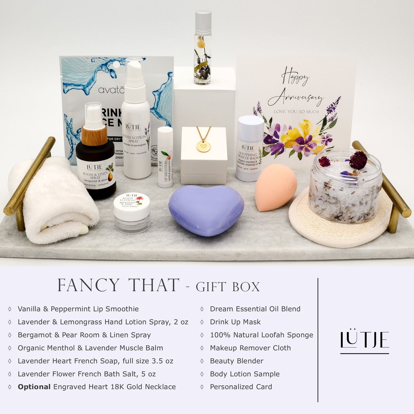 Fancy That Gift Box for women, BFF, wife, daughter, sister, mom, or grandma, includes Lavender & Lemongrass hand lotion spray, essential oil, lip balm, soothing muscle balm, Bergamot & Pear room & linen spray, French soap, French bath salts, hydrating face mask, other bath, spa and self-care items, and optional 18K gold-plated necklace with engraved heart.