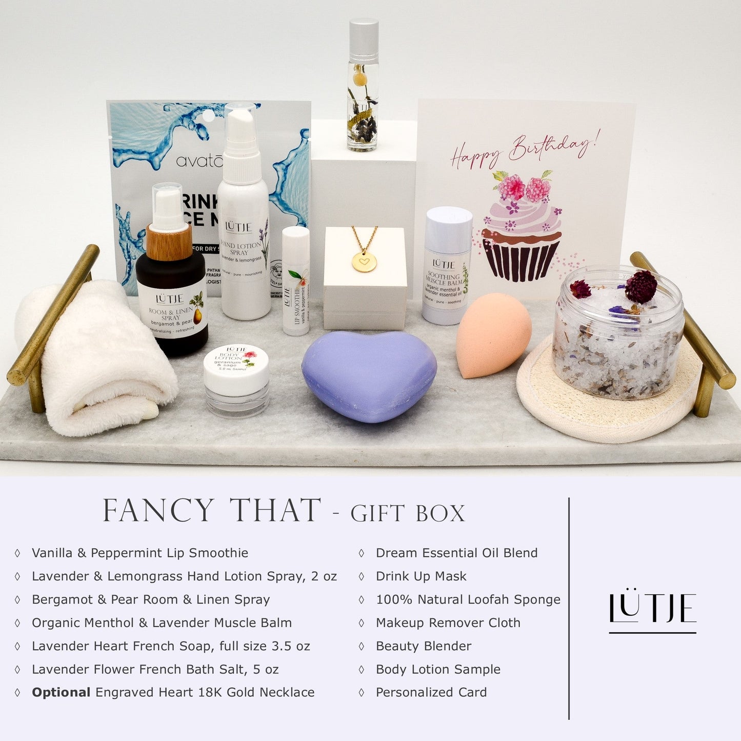 Fancy That Gift Box for women, BFF, wife, daughter, sister, mom, or grandma, includes Lavender & Lemongrass hand lotion spray, essential oil, lip balm, soothing muscle balm, Bergamot & Pear room & linen spray, French soap, French bath salts, hydrating face mask, other bath, spa and self-care items, and optional 18K gold-plated necklace with engraved heart.