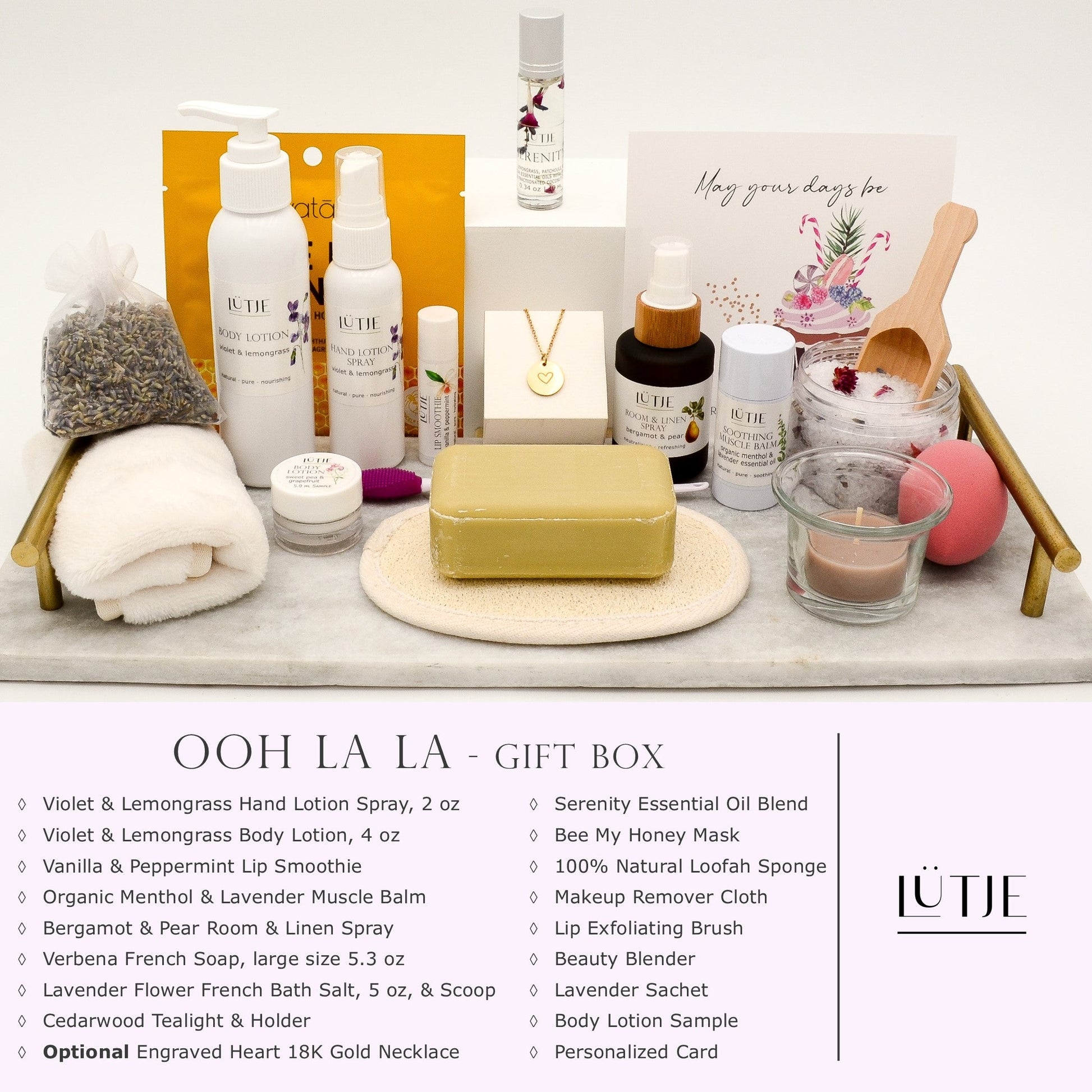 Ooh La La Gift Box for women, wife, daughter, BFF, sister, mom, or grandma, includes Violet & Lemongrass hand lotion spray and body lotion, essential oil, lip balm, soothing muscle balm, Bergamot & Pear room & linen spray, French soap, French bath salts, hydrating face mask, other bath, spa and self-care items, and optional 18K gold-plated necklace with engraved heart.