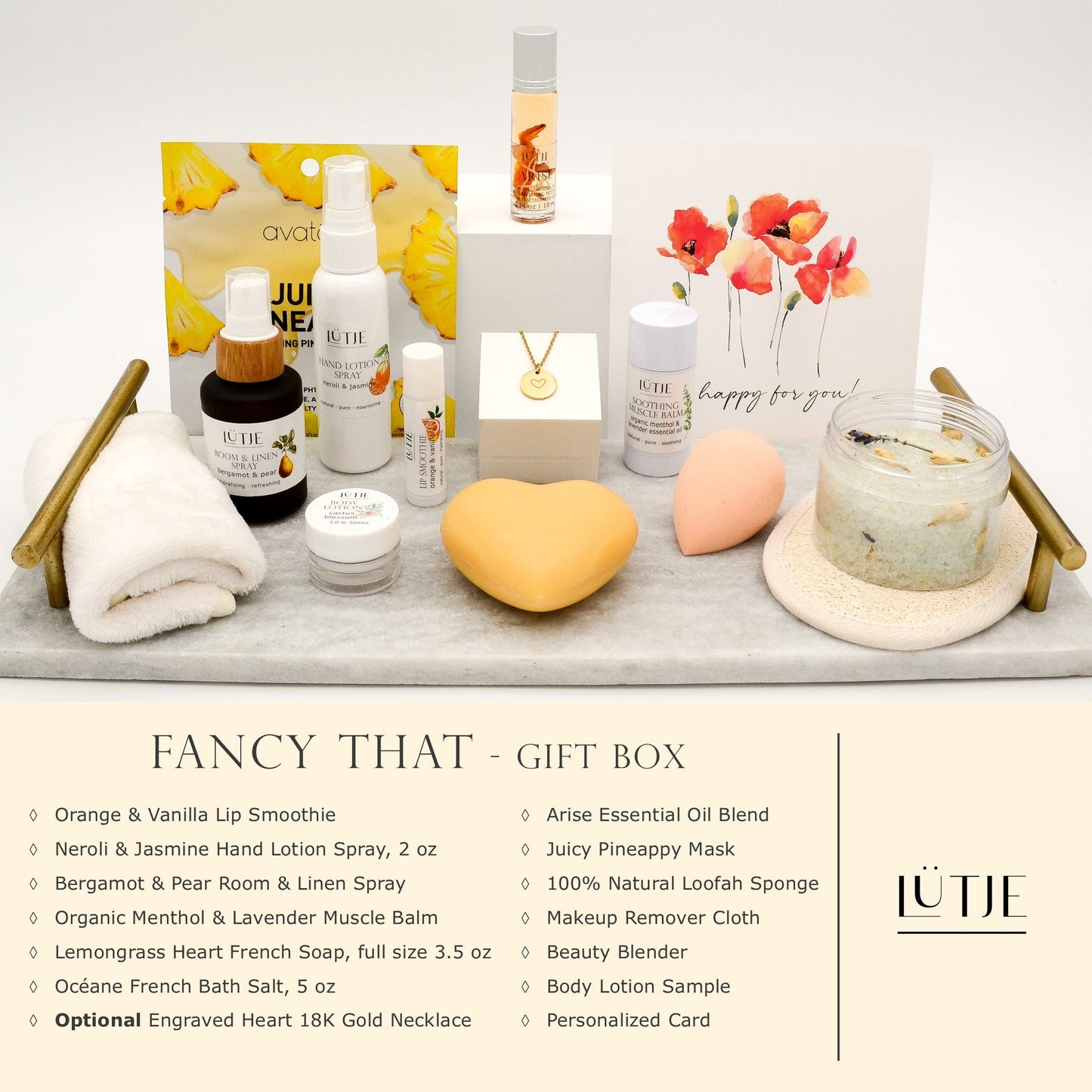 Fancy That Gift Box for women, BFF, wife, daughter, sister, mom, or grandma, includes Neroli & Jasmine hand lotion spray, essential oil, lip balm, soothing muscle balm, Bergamot & Pear room & linen spray, French soap, French bath salts, hydrating face mask, other bath, spa and self-care items, and optional 18K gold-plated necklace with engraved heart.