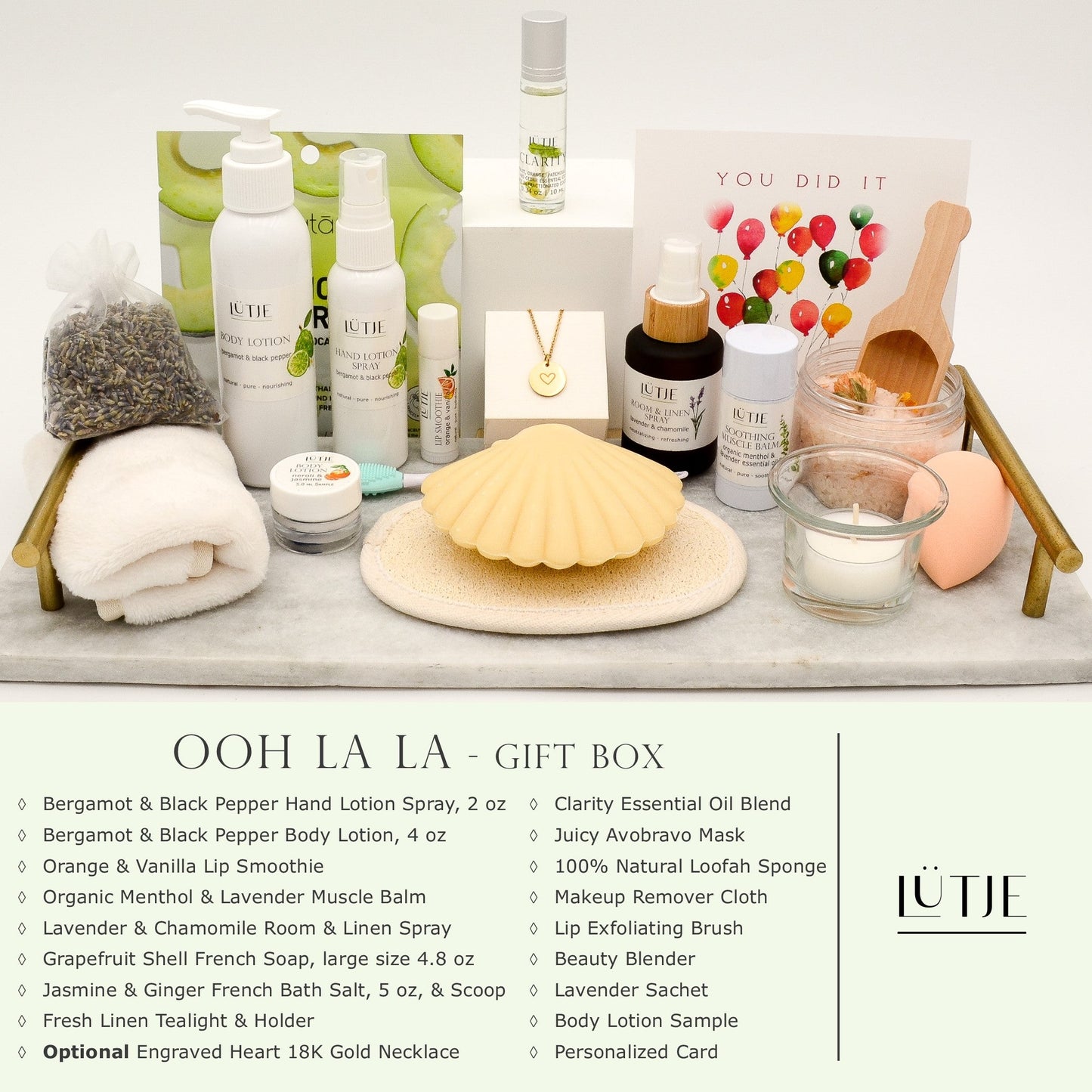 Ooh La La Gift Box for women, wife, daughter, BFF, sister, mom, or grandma, includes Bergamot & Black Pepper hand lotion spray and body lotion, essential oil, lip balm, soothing muscle balm, Lavender & Chamomile room & linen spray, French soap, French bath salts, hydrating face mask, other bath, spa and self-care items, and optional 18K gold-plated necklace with engraved heart.