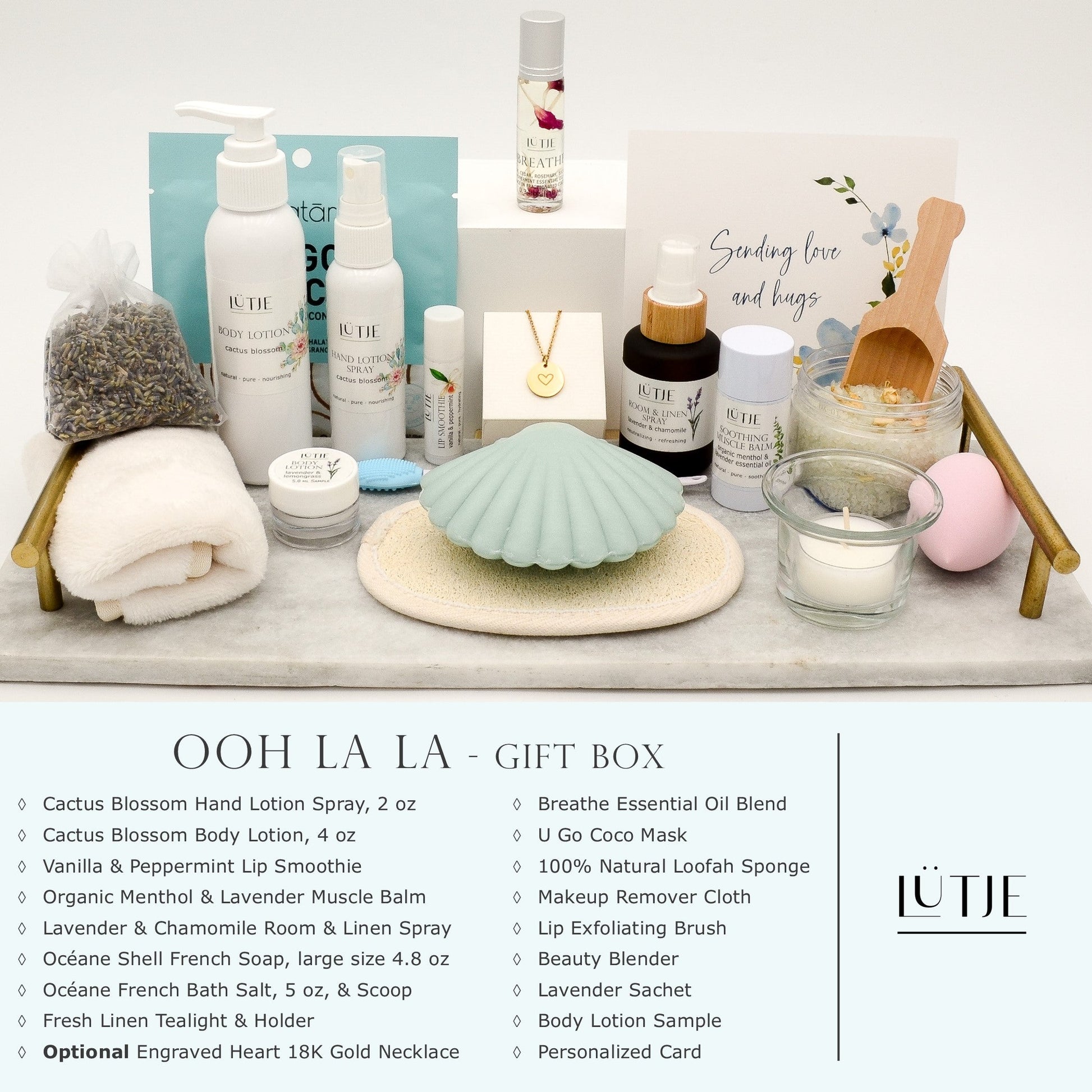 Ooh La La Gift Box for women, wife, daughter, BFF, sister, mom, or grandma, includes Cactus Blossom hand lotion spray and body lotion, essential oil, lip balm, soothing muscle balm, Lavender & Chamomile room & linen spray, French soap, French bath salts, hydrating face mask, other bath, spa and self-care items, and 18K gold-plated necklace with engraved heart.