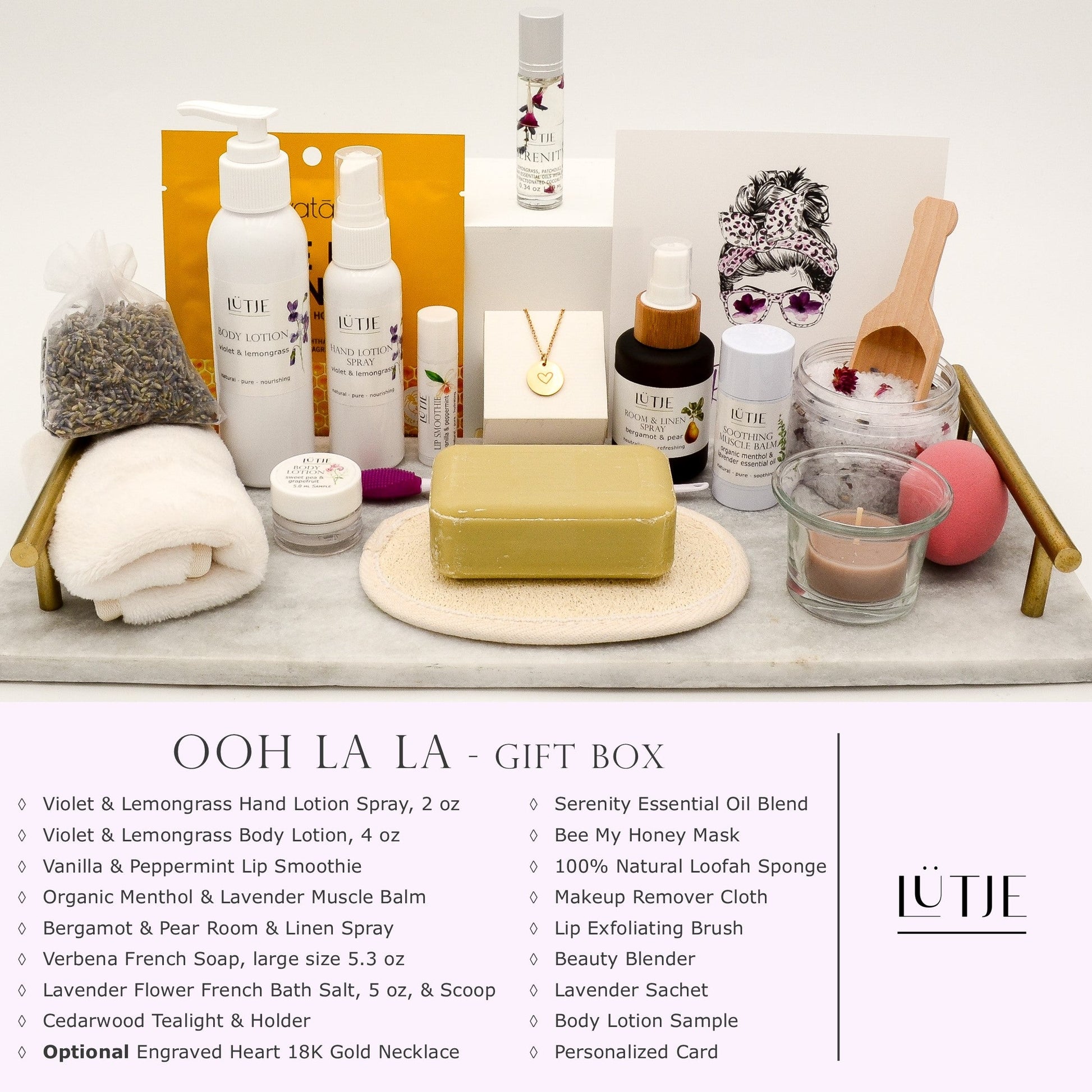 Ooh La La Gift Box for women, wife, daughter, BFF, sister, mom, or grandma, includes Violet & Lemongrass hand lotion spray and body lotion, essential oil, lip balm, soothing muscle balm, Bergamot & Pear room & linen spray, French soap, French bath salts, hydrating face mask, other bath, spa and self-care items, and optional 18K gold-plated necklace with engraved heart.