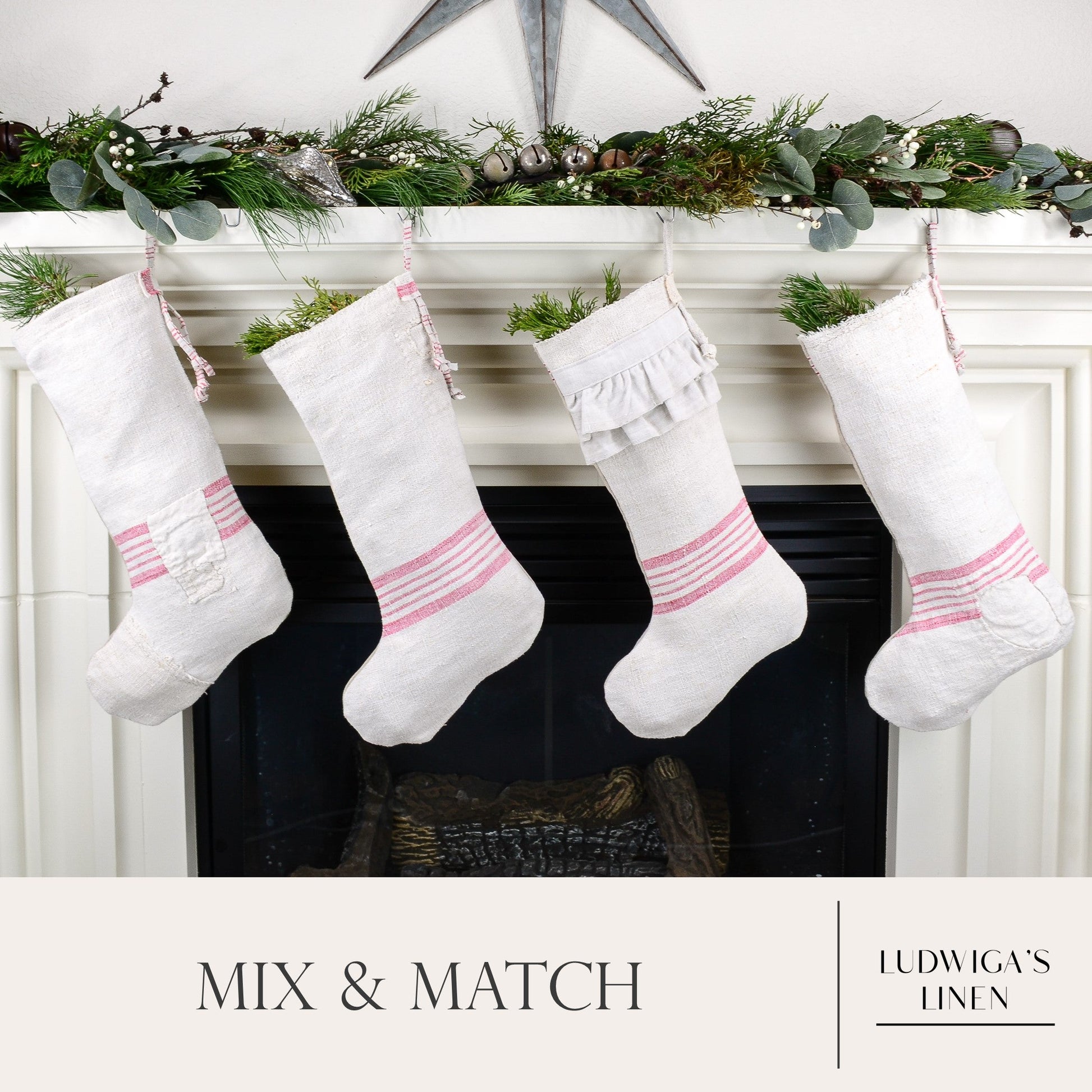 Group of four Christmas stockings hanging on fireplace