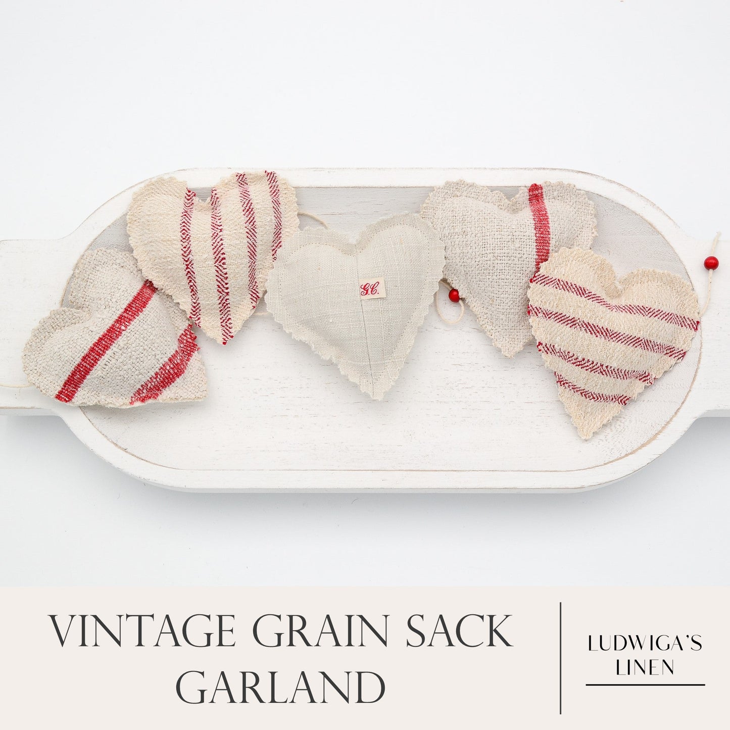 Vintage European grain sack linen garland, white cotton twine and wooden beads between hearts