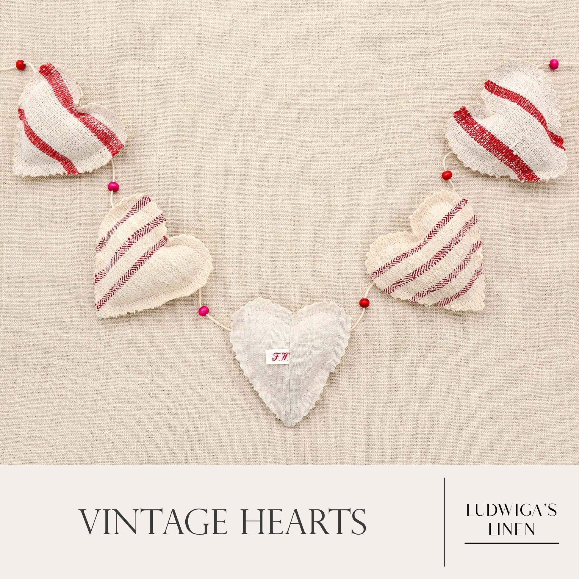 Vintage European grain sack linen garland, five hearts, white cotton twine and wooden beads between hearts