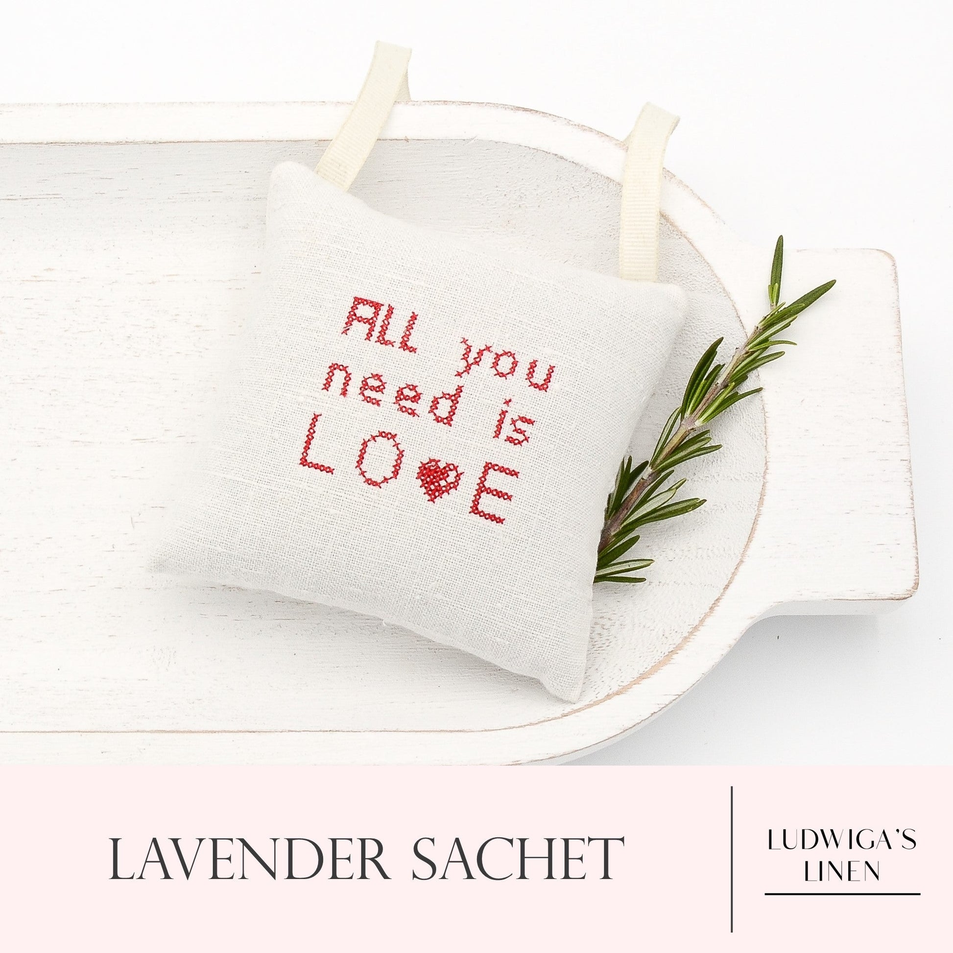 Antique/vintage European white linen lavender sachet square with "all you need is love" embroidered in red, gros grain ribbon tie and filled with high quality lavender from Provence France