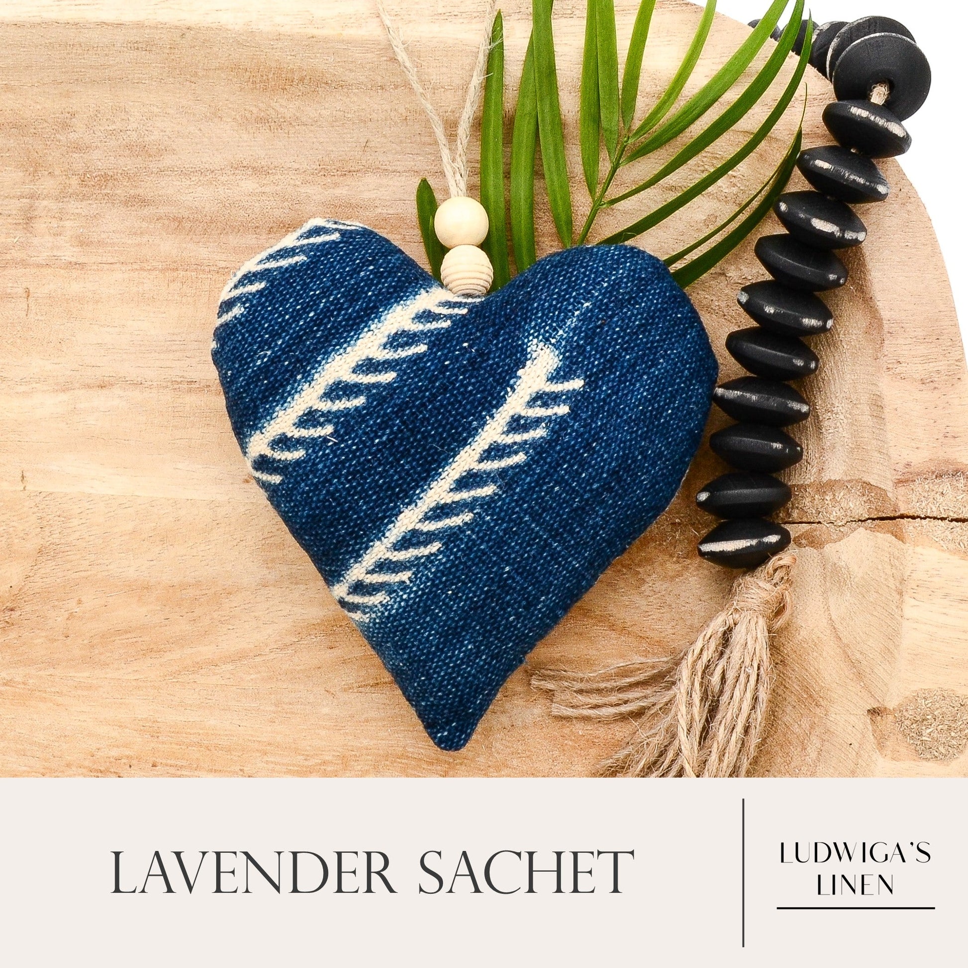 Lavender sachet heart made from handwoven African indigo cotton, hemp twine tie with wooden beads, and filled with high quality lavender from Provence France