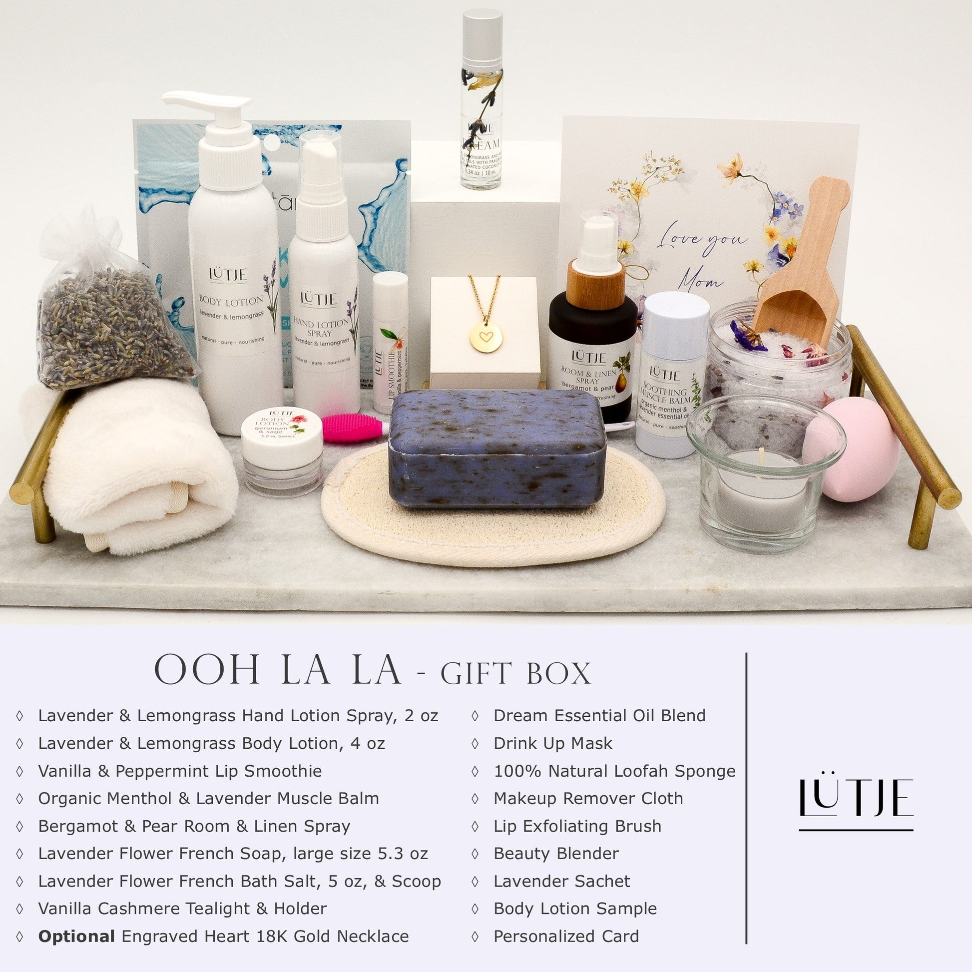 Ooh La La Gift Box for women, wife, daughter, BFF, sister, mom, or grandma, includes Lavender & Lemongrass hand lotion spray and body lotion, essential oil, lip balm, soothing muscle balm, Bergamot & Pear room & linen spray, French soap, French bath salts, hydrating face mask, other bath, spa and self-care items, and optional 18K gold-plated necklace with engraved heart.